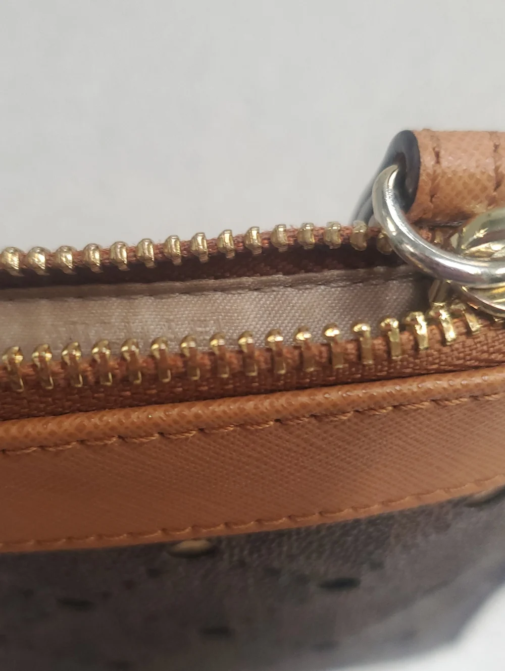 Michael Kors Dark Brown Perforated Zip Clutch with Tan Trim